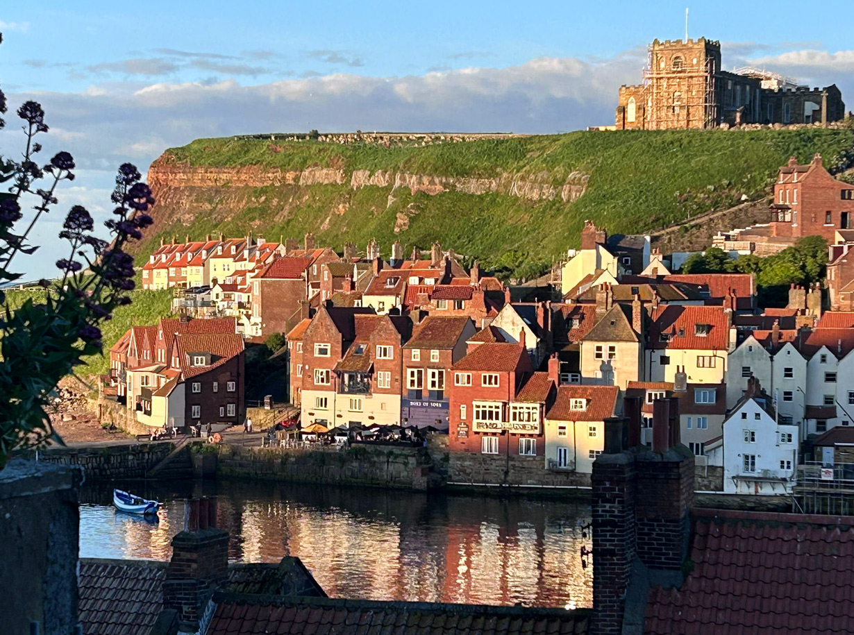 View of Whitby Saint marry's church and harbout taken from the Terrace of Wynd Cottages about an hour before sunset.